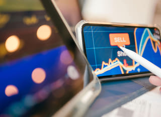 Trader working across several markets while reviewing Bitcoin, Ethereum and forex options